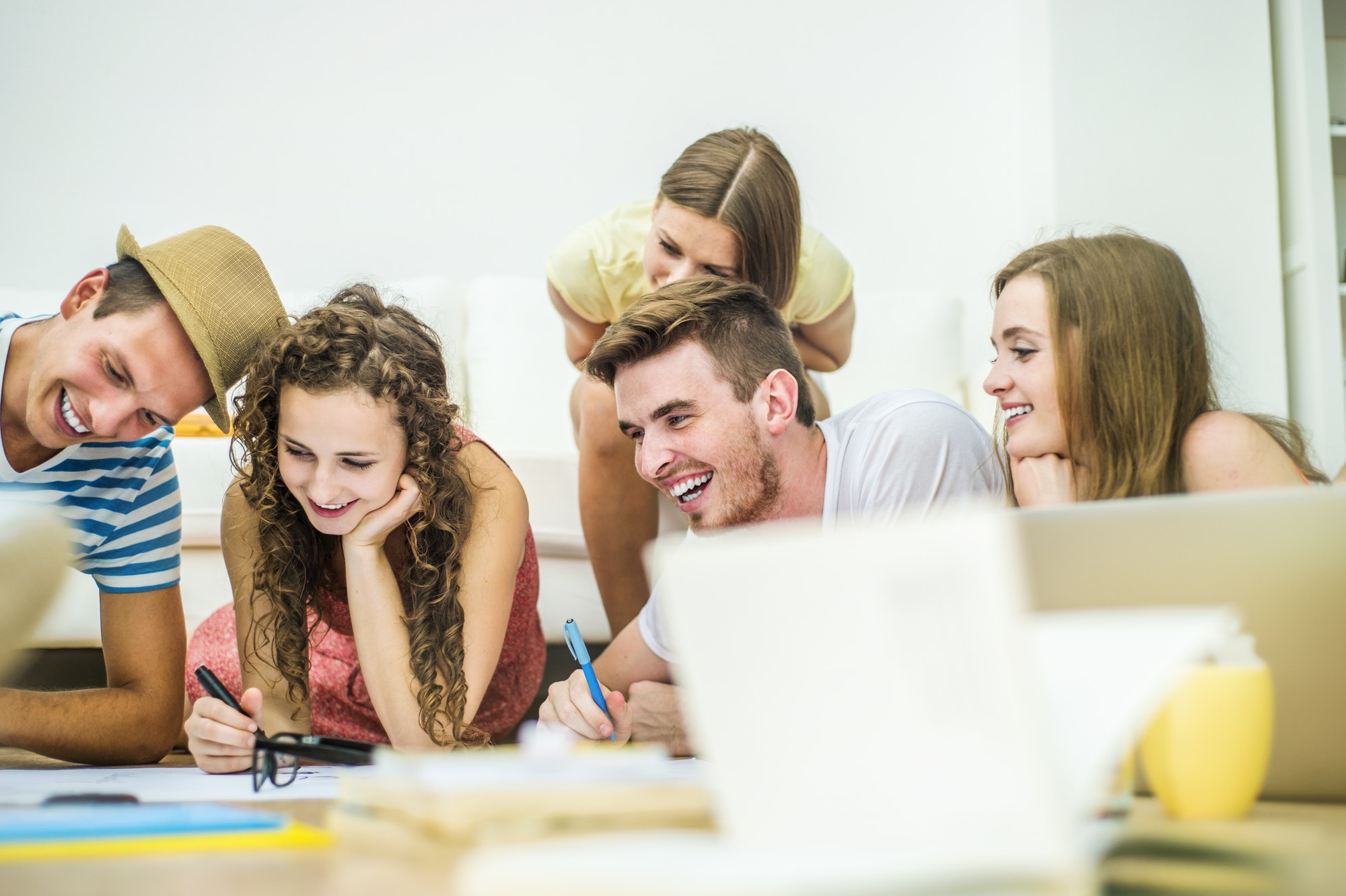 Group of young students studying